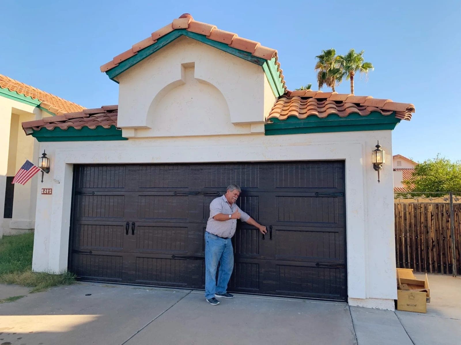 Dark carriage-house garage door serviced by Morning Star