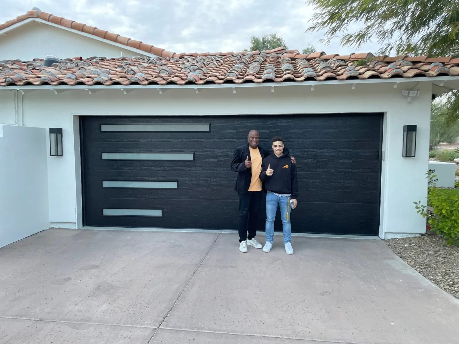 Modern flush garage door with a smart opener installed by Morning Star